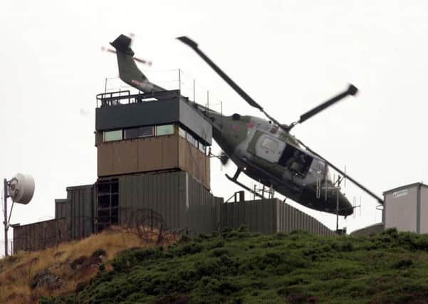 A British army watchtower on the border in south Armagh before it was dismantled in 2005: The supply of weapons to the Provisionals was almost entirely by routes that passed through the Republic