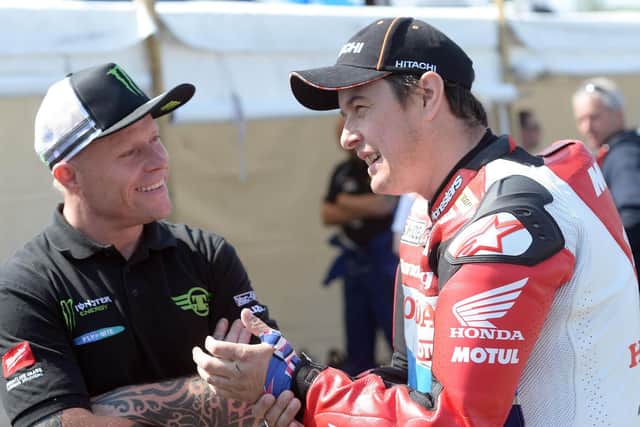Keith Flint in conversation with John McGuinness prior to the start of the Superbike TT in 2014.