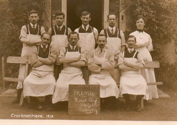 Eight men and one woman in aprons at Crocknacrieve