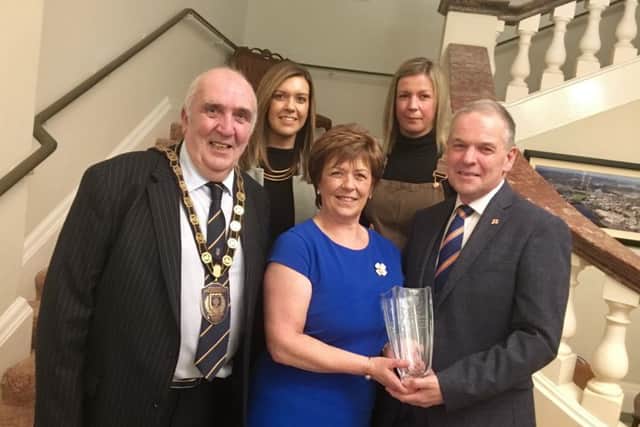 Stuart Brooker and his family, wife Caroline and daughters Nicola and Melanie, with chairman of Fermanagh and Omagh District Council, councillor Howard Thornton, at the civic reception at Enniskillen Town Hall