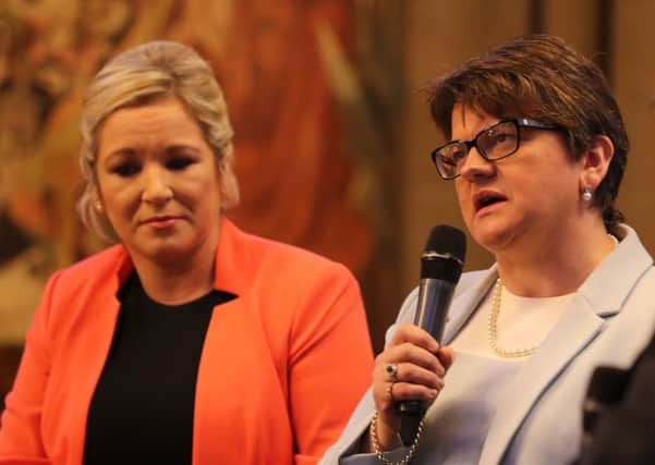 DUP leader Arlene Foster and Sinn Fein's Stormont leader Michelle O'Neill at the Conservative Party conference in 2017. Ms O'Neill is a former agriculture minister, Mrs Foster a former enterprise one. Both departments were part of the government promotion of RHI. Pic: Owen Humphreys/PA Wire