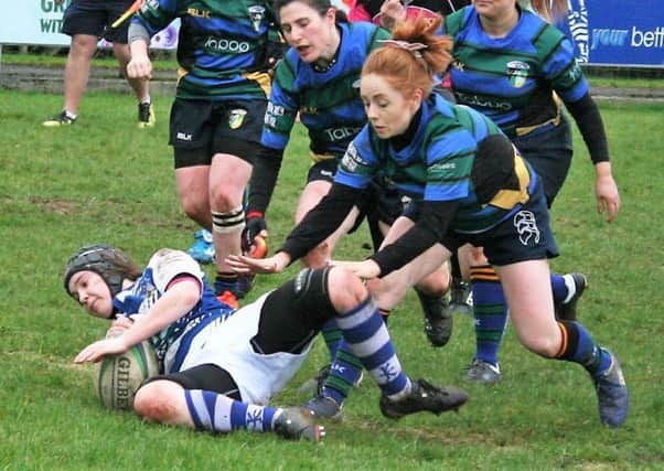 Laura Saunders scores a try for Dungannon