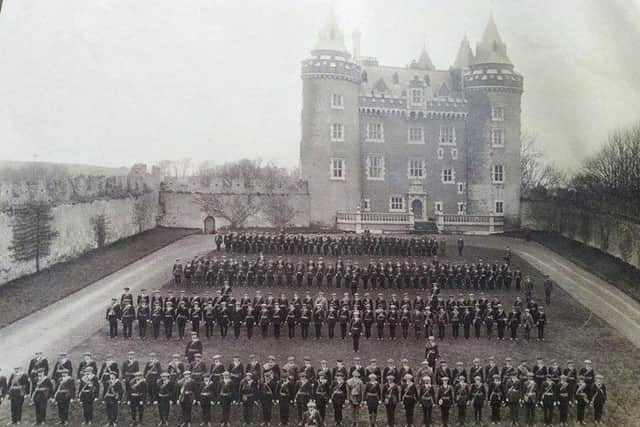 The Ulster Volunteers line up in front of Killyleagh Castle. Many were to die at the Battle of the Somme.