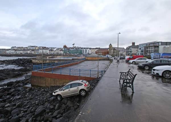The scene in Portstewart after a car plunged over the seawall onto rocks below