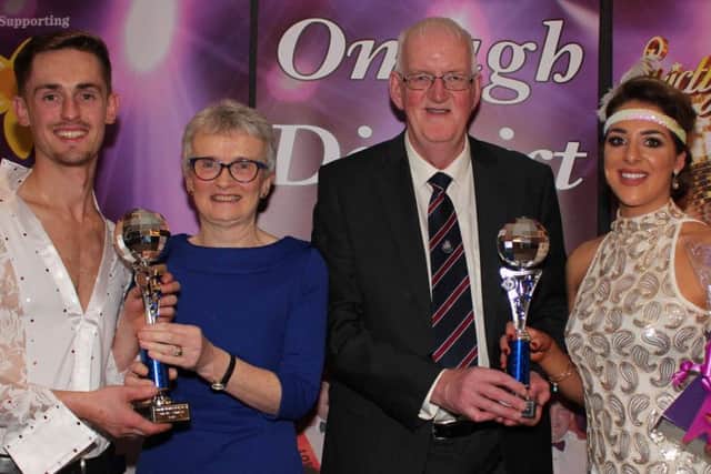 Judges winners David Patterson and Katherine Willis receive their trophies from Robert and Margaret Cummings