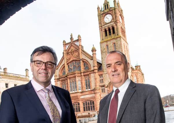 Invest NI CEO Alastair Hamilton, left, pictured at the Guildhall announcement with Kieran Hegarty, president of Terex Materials Processing