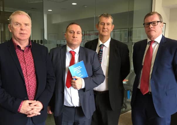 Cyril Glass (left) and Martin Adams from Survivors Together, with DUP MLA Edwin Poots and solicitor Kevin Winters, who is representing some of the victims