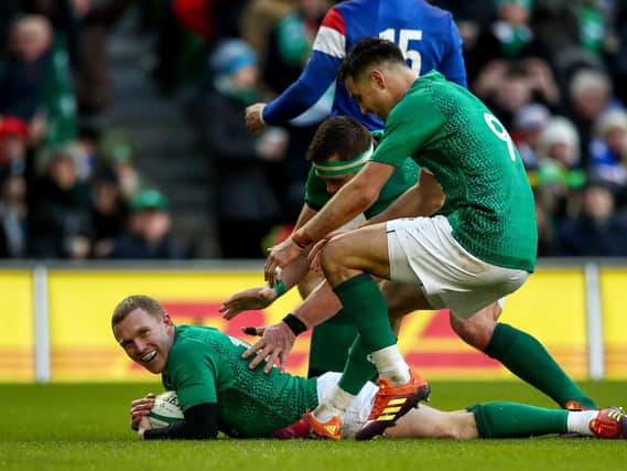 Keith Earls celebrates going over for Ireland's fourth try against France