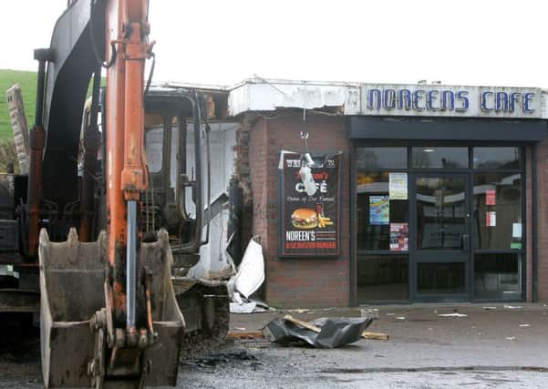 The scene at a filling station on the Ballygawley Road, Dungannon, where thieves used a stolen digger to rip a cash machine from a wall, causing "substantial damage to the building". Picture by Ann McManus