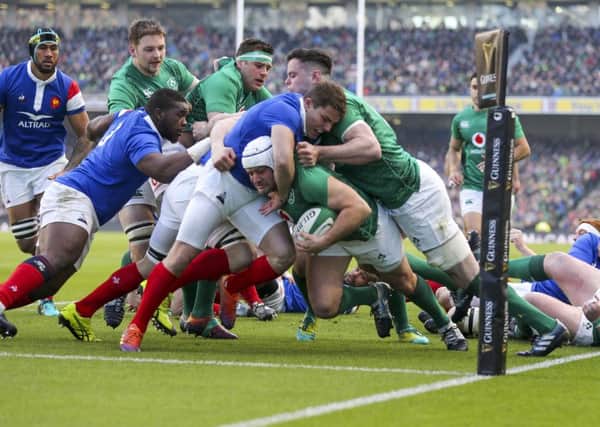 Ireland captain Rory Best drives for the line to score the opening try against France