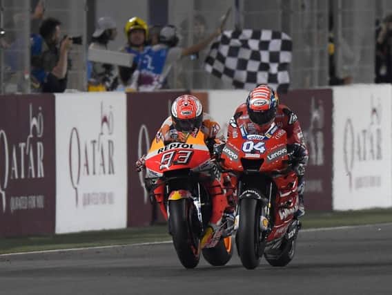 Ducati's Andrea Dovizioso held off Repsol Honda rider Marc Marquez to win the opening MotoGP race of 2019 at the Losail International Circuit in Qatar.