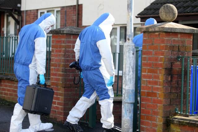 Forensic experts at the scene in east Belfast where a murder investigation has been launched after a 53-year-old woman's body was found on Sunday night in the Whincroft Way area of the Braniel estate. 

Pic by Jonathan Porter/PressEye