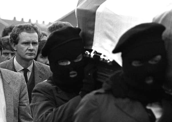 Martin McGuinness (left) follows the coffin of IRA man Charles English in Londonderry in 1984