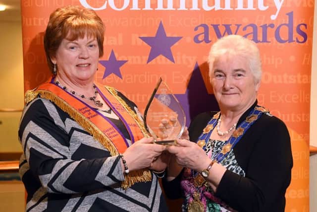 May Dickson (left) receives the inspirational Orangewoman of the year award from Grand Mistress Joan Beggs