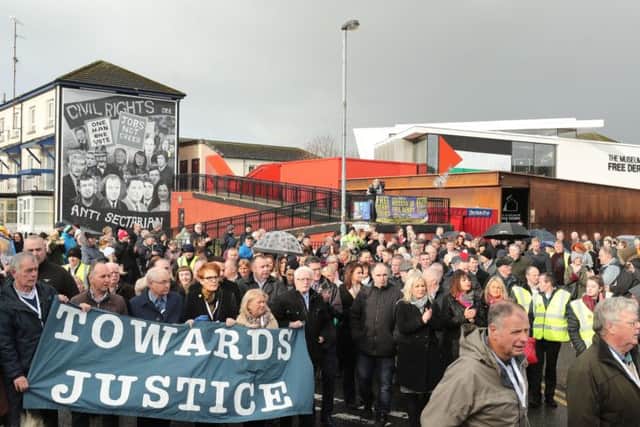 Families of those who died on Bloody Sunday marching through the Bogside in Londonderry. Pic: Niall Carson/PA Wire