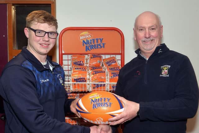 Omagh/Dungannon's Micah Anderson receives the Nutty Krust man of the match award from Portadown Rugby Club president, Clive Bowles