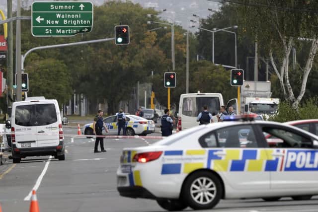 Police block the road near the shooting at a mosque in Linwood, Christchurch, New Zealand. (AP Photo/Mark Baker)