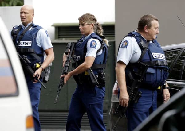 Armed police patrol outside a mosque in central Christchurch, New Zealand. (AP Photo/Mark Baker)