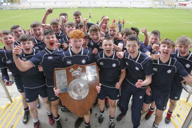 Johnny O'Kane and his team celebrate winning the 2019 Ulster Schools Medallion Shield Final against holders Ballymena Academy