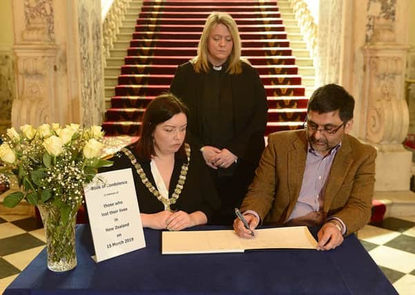 A book of condolence for those who lost their lives in the  attacks in New Zealand has been opened at Belfast City Hall.   The Lord Mayor Deirdre Hargey is pictured with Dr Muhammad Saleem Tareen, a member of the Executive Committee of Belfast Islamic Centre, and Karen Sethuraman, the Lord Mayor's Chaplain. Photo Arthur Allison/Pacemaker