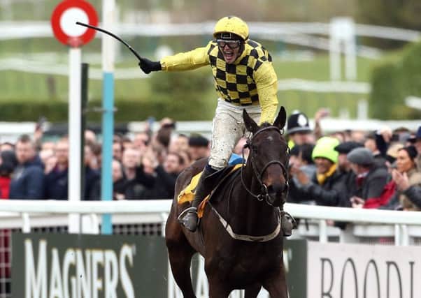 Jockey Paul Townend celebrates his victory in the Magners Cheltenham Gold Cup Chase on Al Boum Photo.