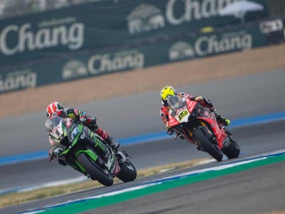 World Superbike champion Jonathan Rea is chased by Alvaro Bautista at the Chang International Circuit in Thailand.