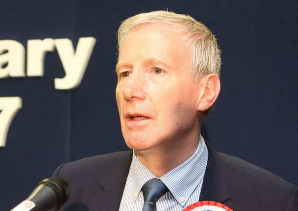 DUP MP Gregory Campbell said the banner summed up Sinn Fein's 'attitude to truth and respect'