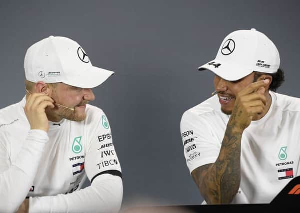 Mercedes drivers Lewis Hamilton of Britain, right, and Valtteri Bottas of Finland
