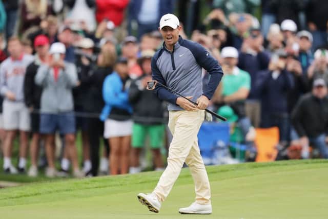 Rory McIlroy of Northern Ireland reacts on the 18th green during the final round of The PLAYERS Championship on The Stadium Course at TPC Sawgras