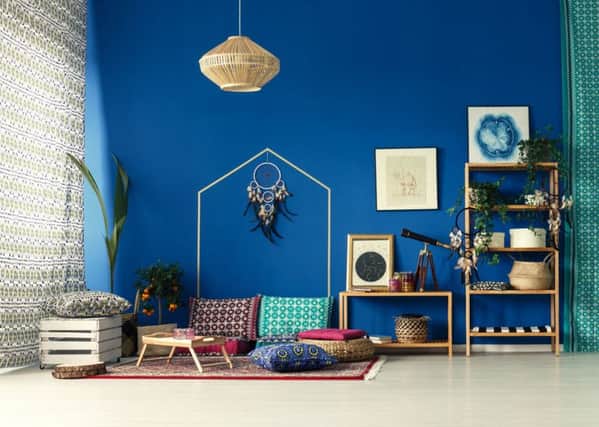 Undated Handout Photo of LEO  Bohemian home interior with cobalt blue wall and bright green plants to suit an outgoing Leo.  See PA Feature INTERIORS Horoscope Decor. Picture credit should read: ScS/PA. WARNING: This picture must only be used to accompany PA Feature INTERIORS Horoscope Decor. WARNING: This picture must only be used with the full product information as stated above.