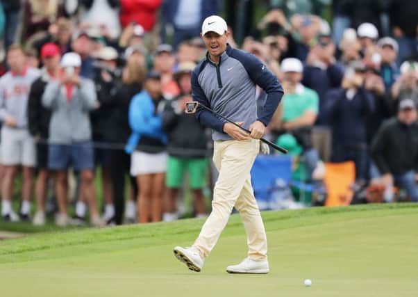 Rory McIlroy of Northern Ireland reacts on the 18th green during the final round of The PLAYERS Championship on The Stadium Course at TPC Sawgrass