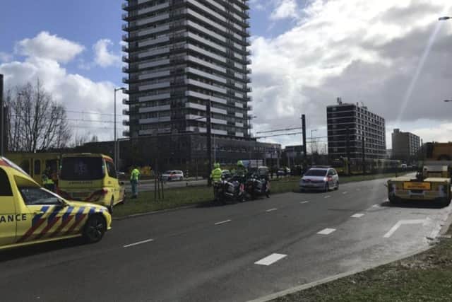 Police in the central Dutch city of Utrecht say on Twitter that "multiple" people have been injured as a result of a shooting in a tram in a residential neighborhood. (Martijn van der Zande via AP)