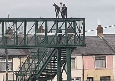 Children on top of the footbridge over the railway line in Lurgan