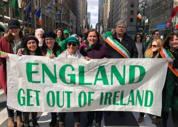 Sinn Fein leader Mary Lou McDonald posted the picture of herself (centre) behind the banner along with Irish republican supporters in the US