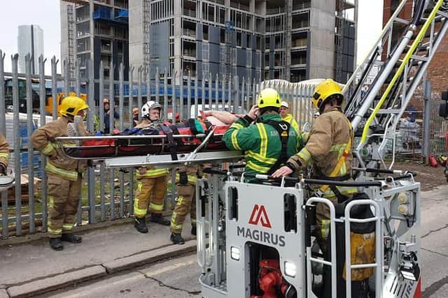 The casualty was rescued from the eighth floor of a building at Little Patrick Street/York Street. Pics by NIFRS East