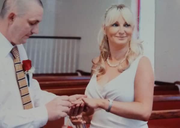 Julie and her husband Martin McMullan on their wedding day