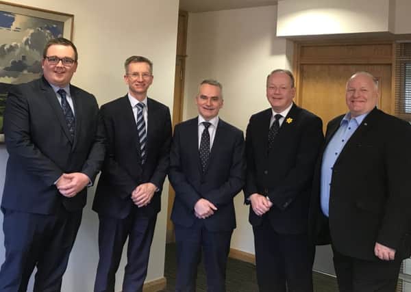 Chris Conway (centre), CEO of Translink, with DUP representatives Marc Collins,  Ald Brian Kingston, William Humphrey MLA and David Hilditch MLA.