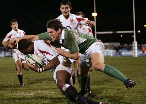 Ireland's Darren Cave with Selorm Kuadey of England during the U20 Six Nations Championship game in 2007 - Ireland clinched the Grand Slam