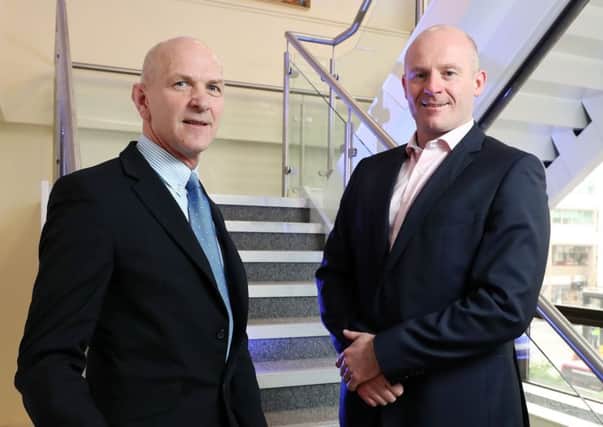 HNH director Wayne Horwood pictured, right, with George McKinney, director of technology and services with Invest NI