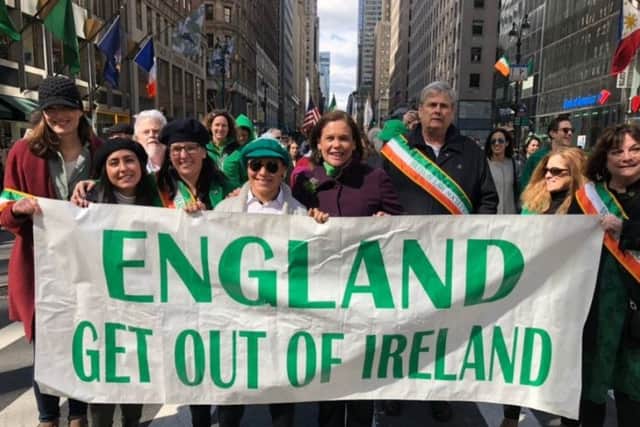 Mary Lou McDonald stands behind the controversial St Patrick's Day banner in New York