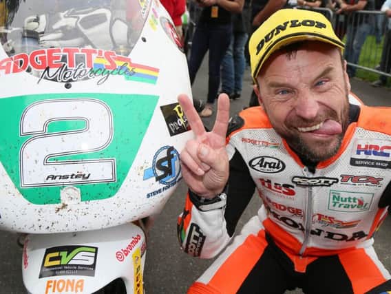 Bruce Anstey celebrates after winning the Lightweight 250 race at the Classic TT in 2017.