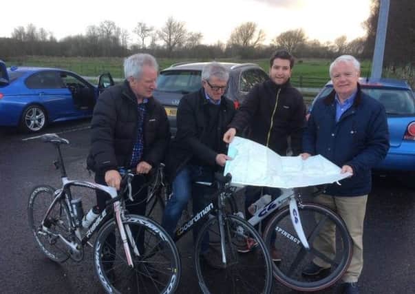 Broughshane's Lexie Scott getting some advice on cycle routes from Wooler representatives. (L-R) Bob Snooks, Tom Johnston, and Alistair Hernandez.