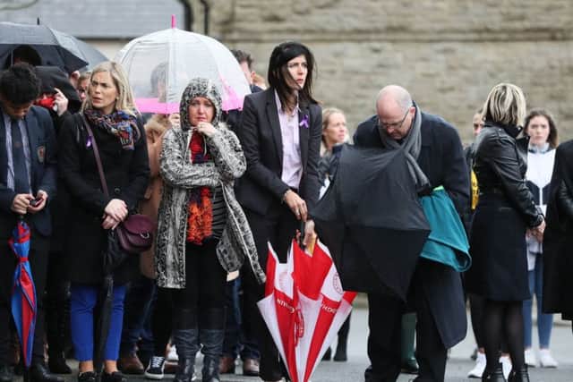 Catherine McHugh (holding red and whit umbrella), principal of St Patrick's College, Dungannon at the funeral of Morgan Barnard at St Patrick's Church, Dungannon. PRESS ASSOCIATION Photo. Picture date: Friday March 22, 2019. Teenagers Lauren Bullock, Connor Currie and Morgan Barnard died after a crush at the Greenvale Hotel in Cookstown, Co Tyrone, on Sunday. See PA story ULSTER Cookstown. Photo credit should read: Brian Lawless/PA Wire