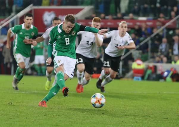 Northern Ireland's Steven Davis scores a penalty against Estonia