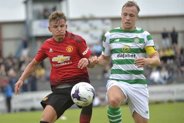Celtic's Kerr McInroy in action with Manchester Uniteds Dion McGhee during last year's Under-19 SuperCupNI game at Coleraine