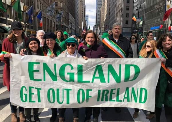 Mary Lou McDonald stands behind the controversial St Patrick's Day banner in New York
