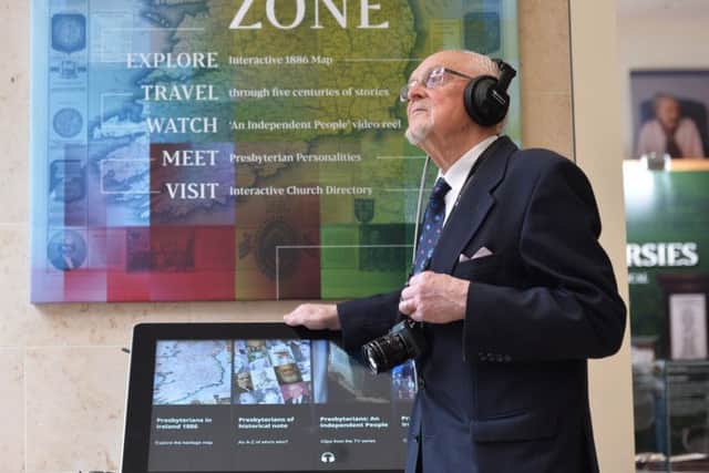 Rev Dr Gordon Gray checks out the interactive zone at the opening of the Presbyterian Church in Irelands new visitor exhibition in Belfast
