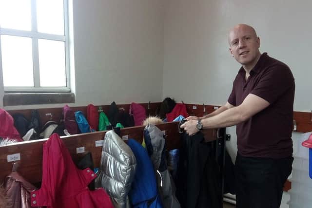Graeme Cousings visits his old cloak room at King's Park Primary School which he remembers as a hot spot for swapping football stickers
