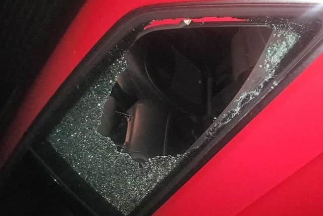 The car window through which a youth was allegedly thrown.