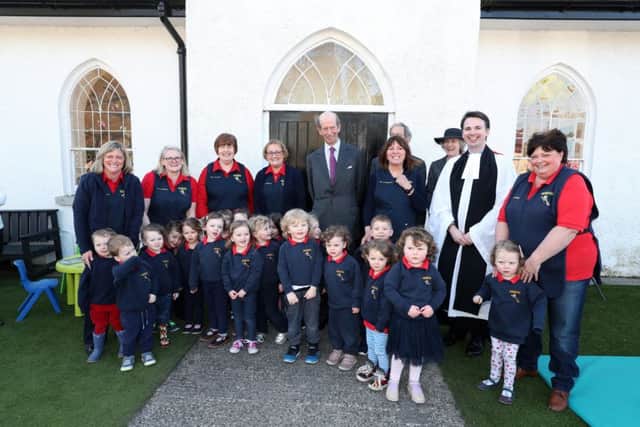 The Duke of Kent with children from the Kilmood play group